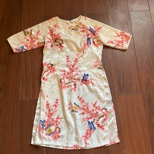 100% silk white floral white dress with side slits on both sides.